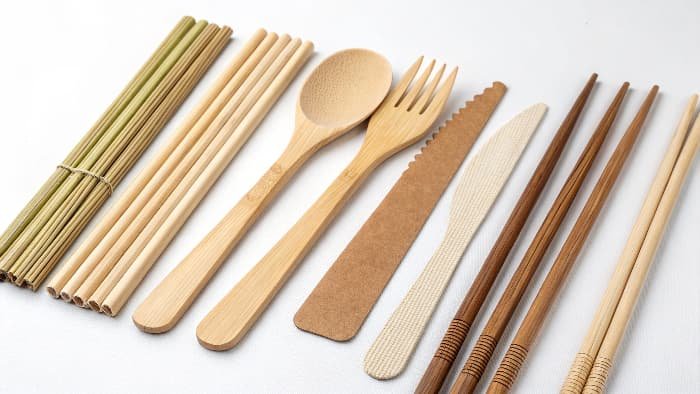 An array of plastic-free stirrers, straws, and cutlery made from wood, bamboo, PLA